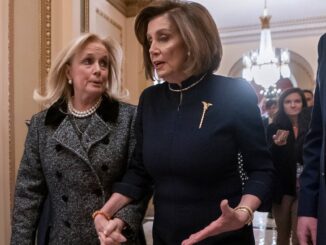 After the 49ers lose the Super Bowl, Dingell gives Pelosi a goodie basket full of candies.