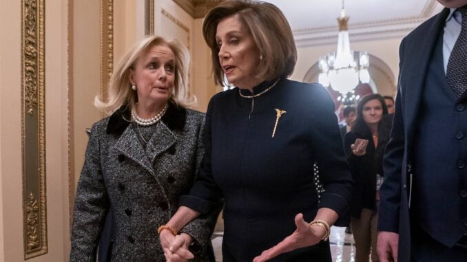 After the 49ers lose the Super Bowl, Dingell gives Pelosi a goodie basket full of candies.